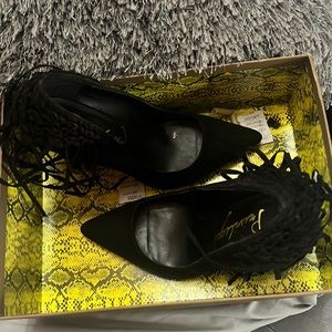 Black suede fringe pumps